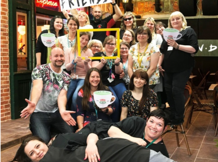 Staff at RNIB college in front of the Central Perk café