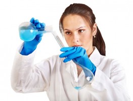 Scientist pouring liquid into a beaker