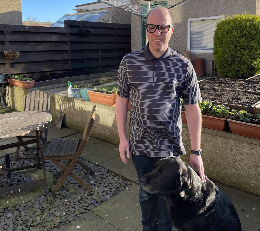 Stuart Beveridge with his guide dog