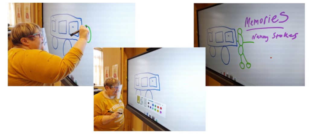 Student writing on the iBoard - sharing her memories 