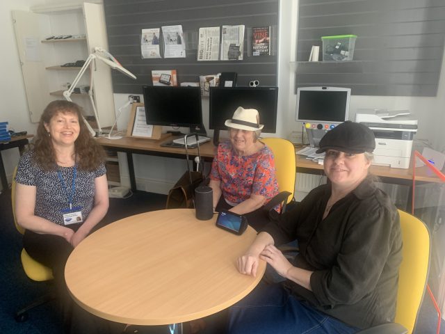 Three ladies from Vision North Somerset sitting around a table