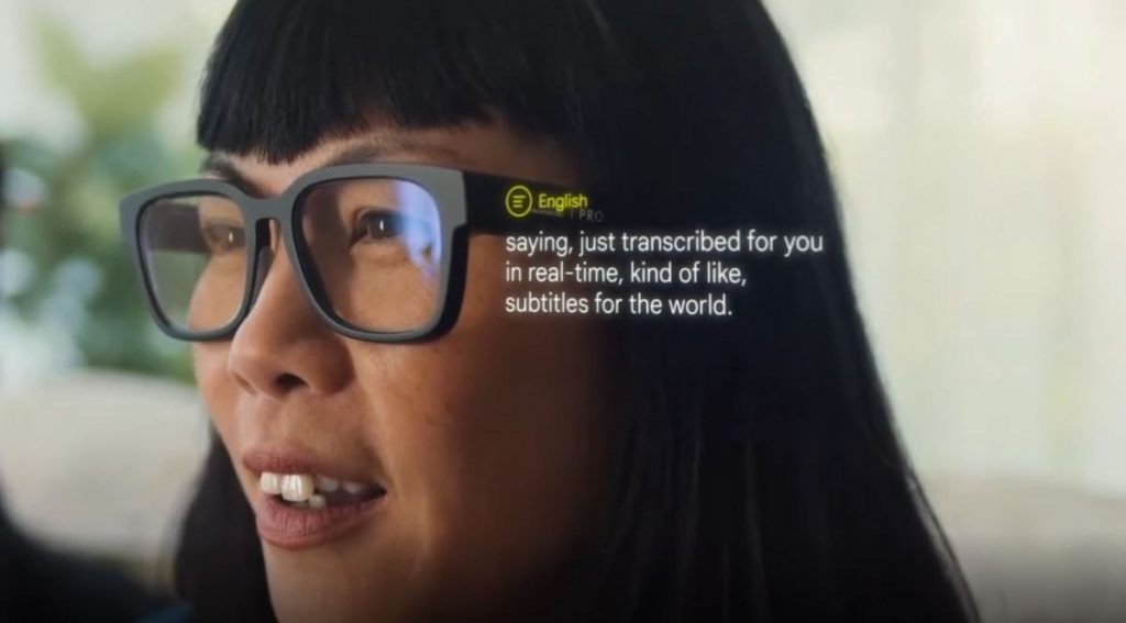 Lady wearing the Google AR glasses prototype with the live translation text being shown