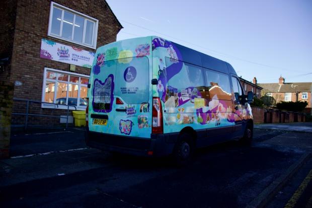 Van parked in front of the Buzz Hub building. The Van's artwork features Self portraits and artwork representing the organisation is featured on the community van (Image: Sophie Williamson)