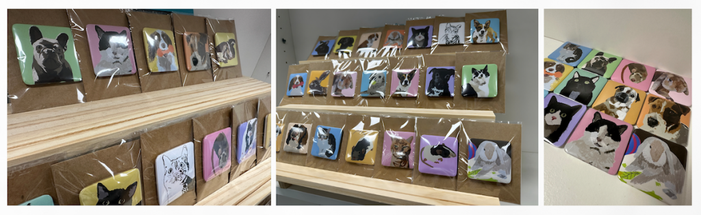 Handmade magnets featuring digital pet portraits, neatly displayed on wooden shelves and a wall, ready for sale at Max’s Legacy fundraising event.