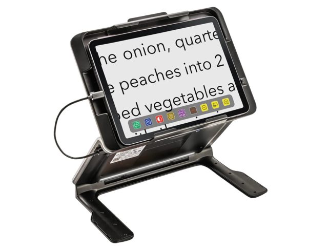 iPad Tablet mounted on an adjustable stand, displaying enlarged text on screen to demonstrate its use as a digital magnifier for reading.